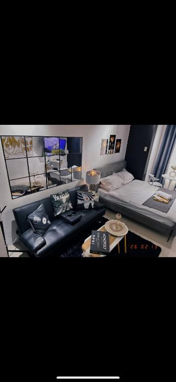 a living room with a couch and a table at A&R Haven in Manila