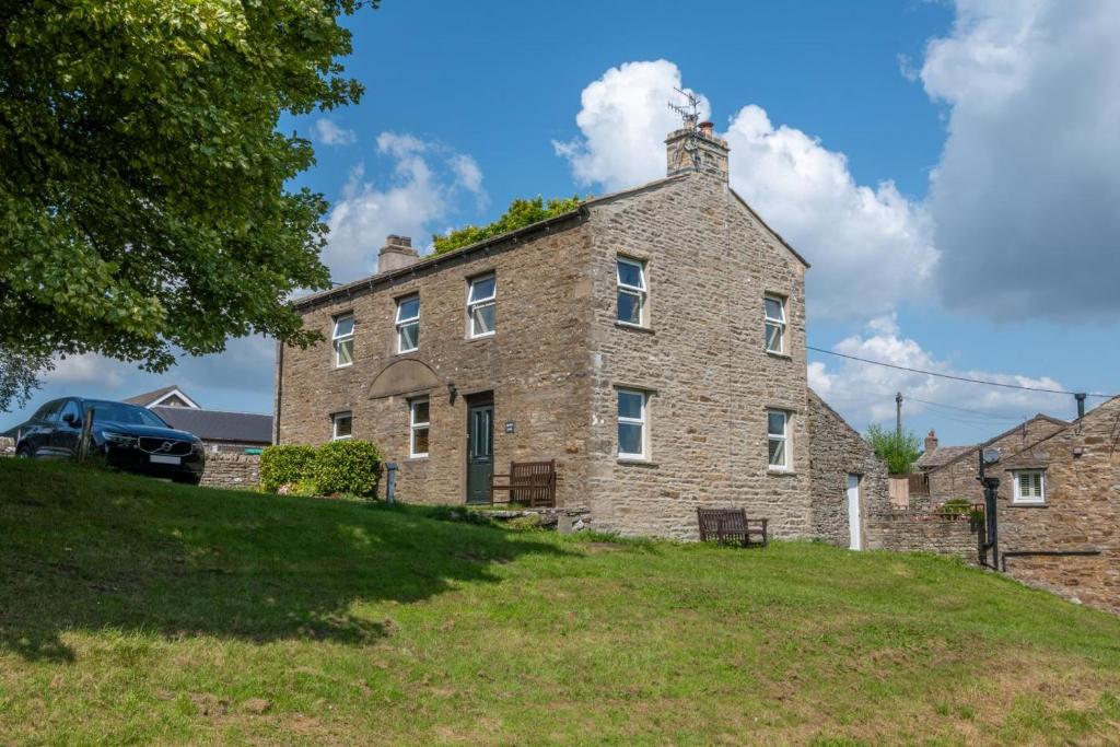 an old stone house on a grassy hill at 3 Bed in Bainbridge oc-ds1026 in Bainbridge