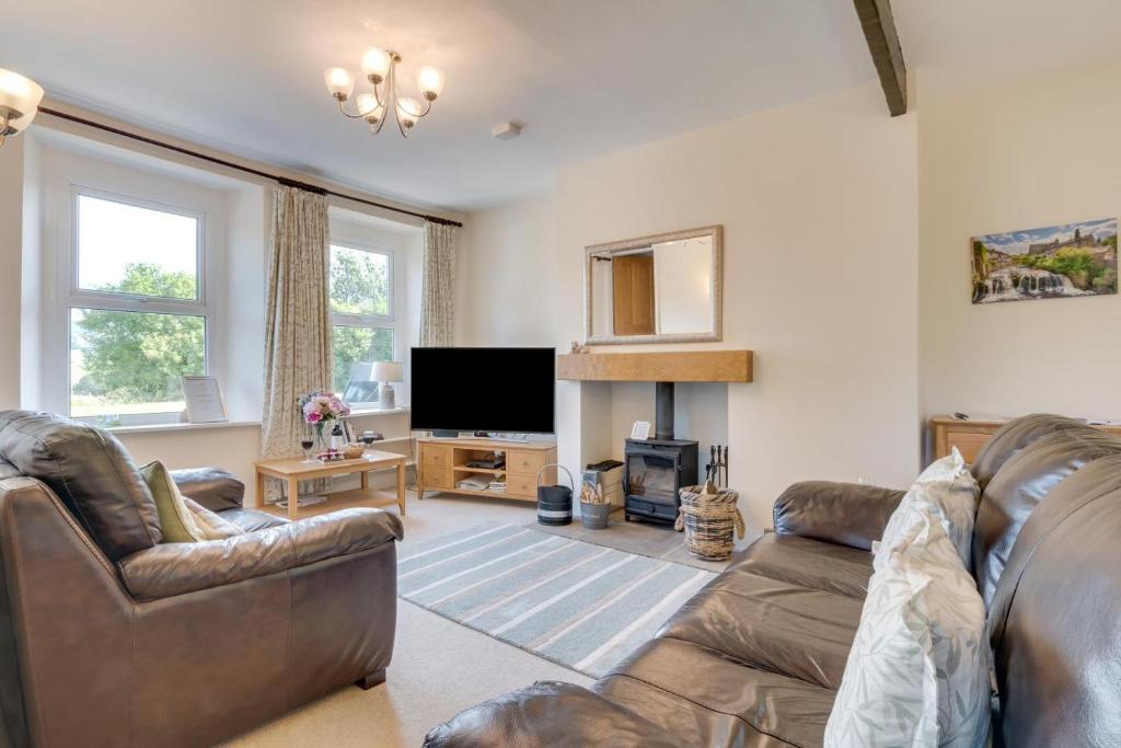 a living room with a couch and a television at 2 Bed in Hawes oc-ds052 in Hawes