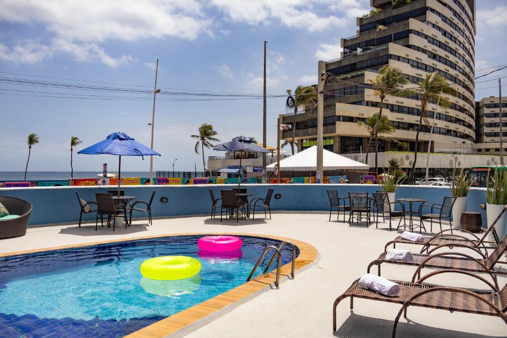 a pool with two frisbees in the water at Bahia Sol e Mar in Salvador