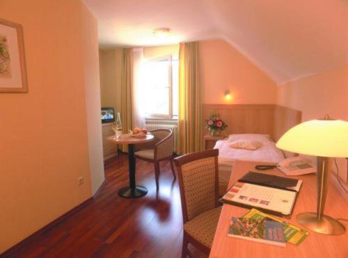 Postel nebo postele na pokoji v ubytování Hotel Ritschlay