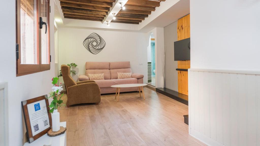 a living room with a couch and a table at Sweet Home by Toledo AP in Toledo
