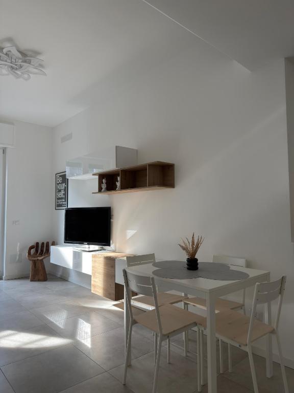 a dining room with a table and chairs at Soul house in Corsico