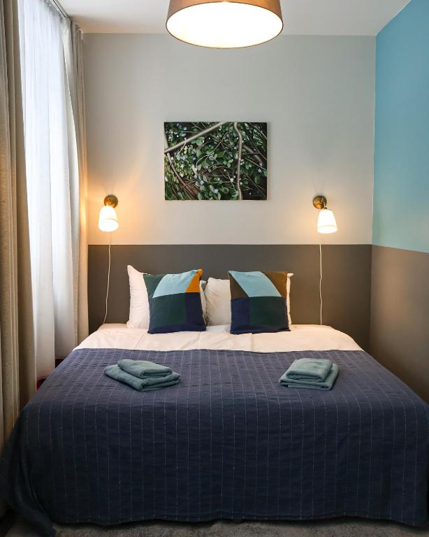 Ліжко або ліжка в номері Zeit Apartment