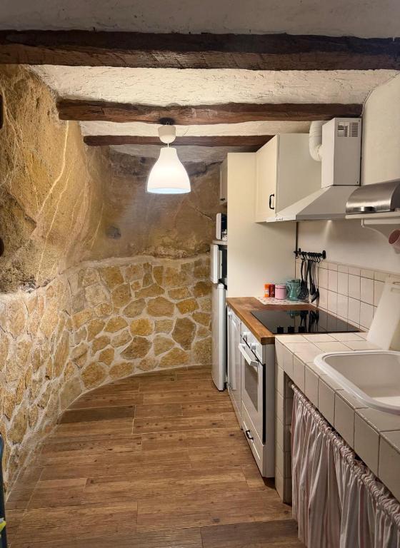 a kitchen with a sink and a counter top at El Encantodemora in Mora de Rubielos