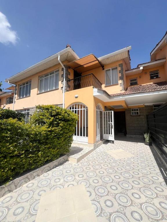 a house with a driveway in front of it at Crystal Luxury Palace in Nairobi
