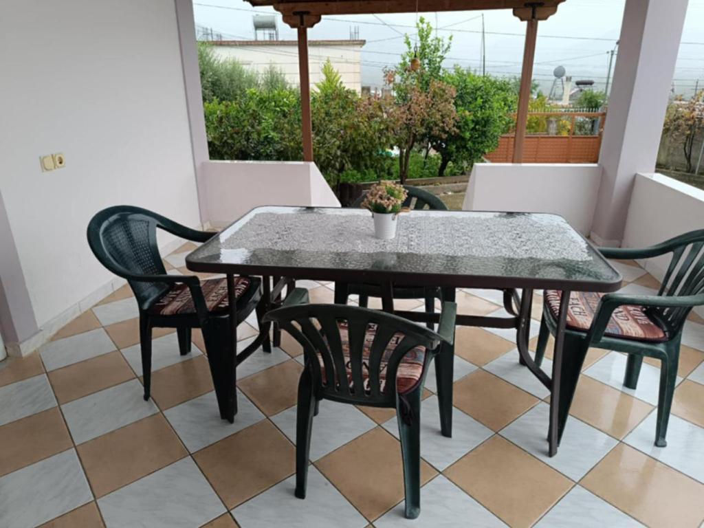 a black table and chairs on a patio at Villa Albano in Delvinë