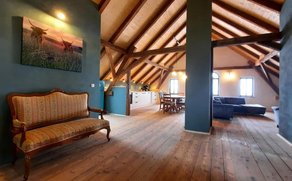a living room with a couch and a table at Ferienwohnung Blauregen - NEU ab März 2026 in Hohnstein