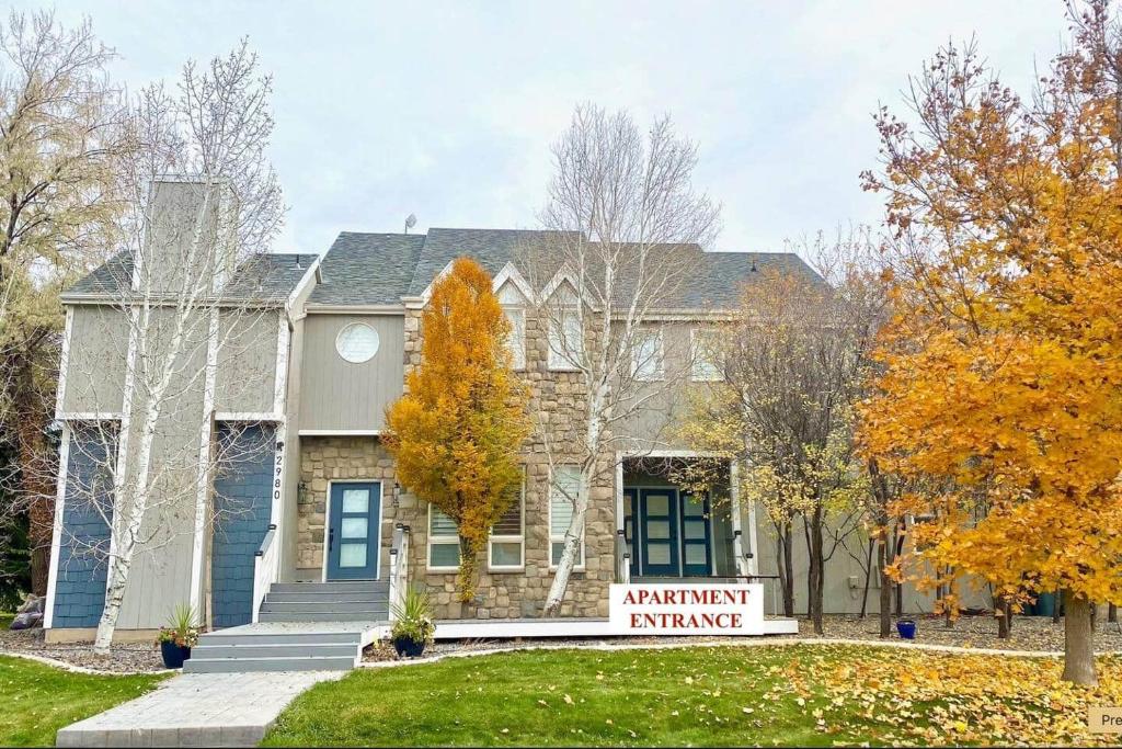 a house with a bench in front of it at Lehi East Bench Private Apt! in Lehi