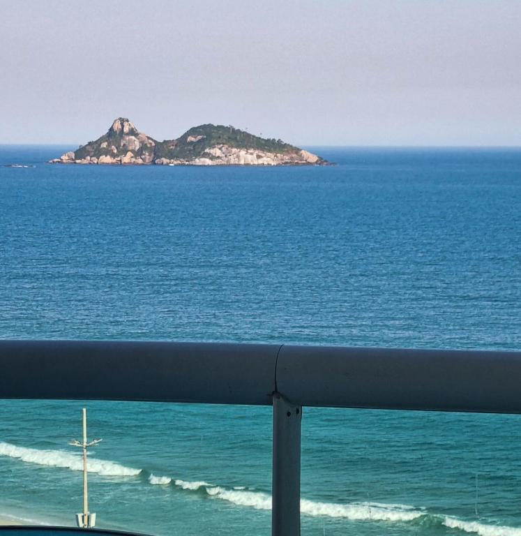a view of an island in the ocean at VISTA ESPETACULAR - TWIN TOWERS - Barra da Tijuca in Rio de Janeiro