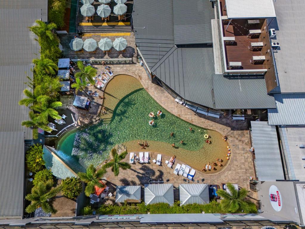 an overhead view of a pool with a resort at Gilligan's Hotel & Resort Cairns in Cairns