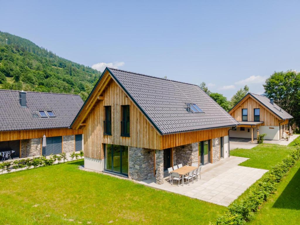 an image of a log home with a yard at Mountain Chalet An der Mur in Sankt Lorenzen ob Murau