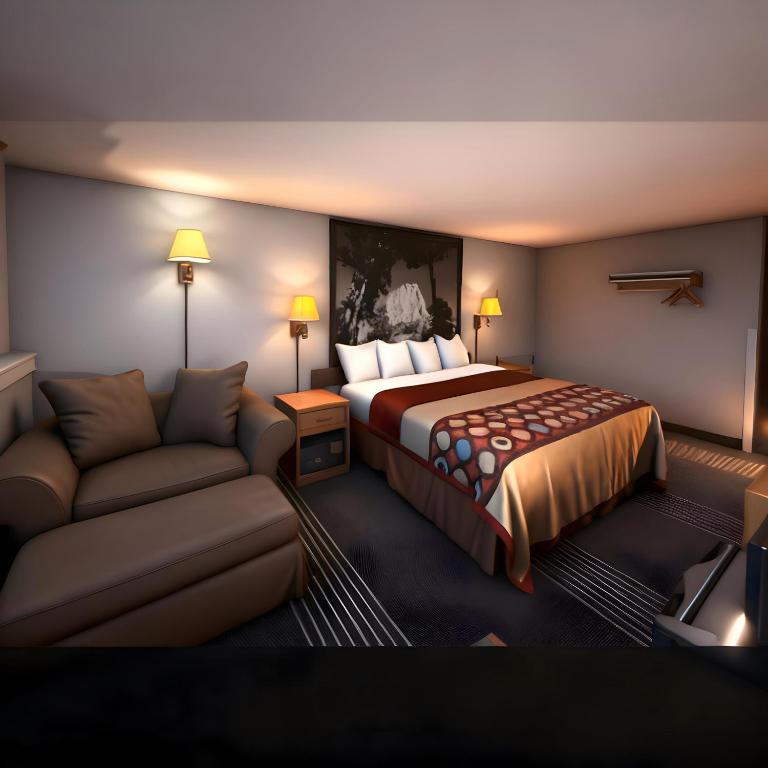 a hotel room with a bed and a couch at Super 8 by Wyndham Belle Fourche SD in Belle Fourche