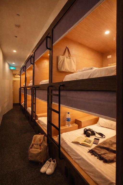 a group of bunk beds in a room at Wink at Perak Road in Singapore