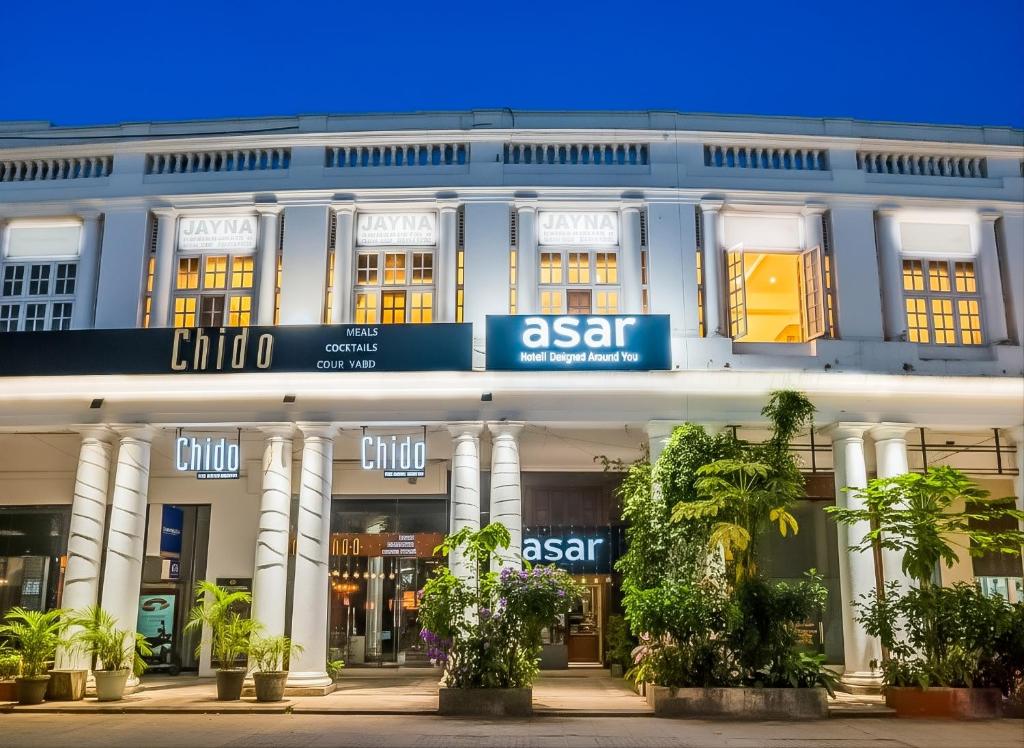 a building with a sign on the front of it at asar CP Outer Circle by Orion Hotels in New Delhi