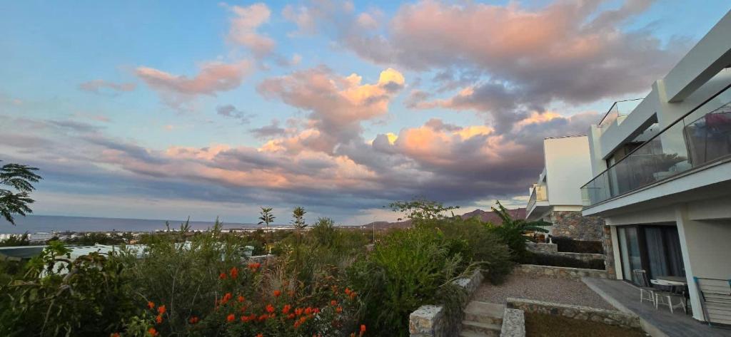 a view of a cloudy sky from a house at Retreat site, block A1, unit 1 in Küçükerenköy
