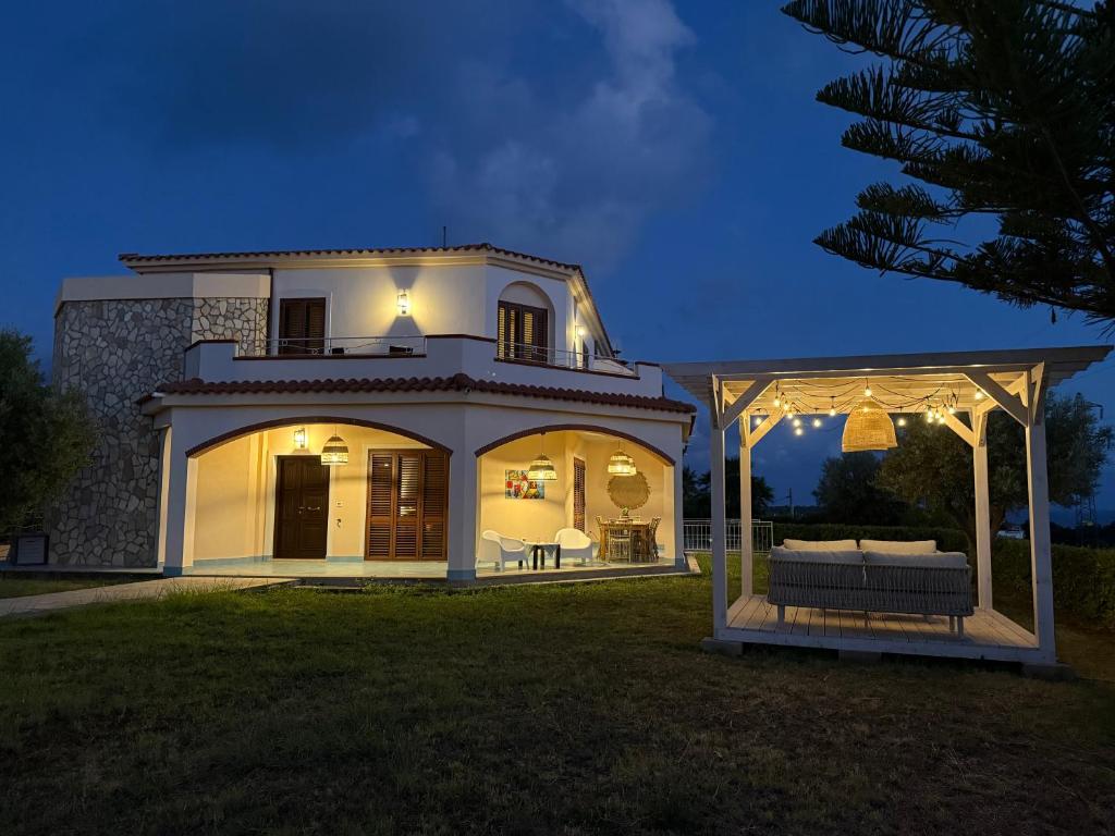 a white house with a gazebo in a yard at Villa BellaVista in Belvedere Marittimo