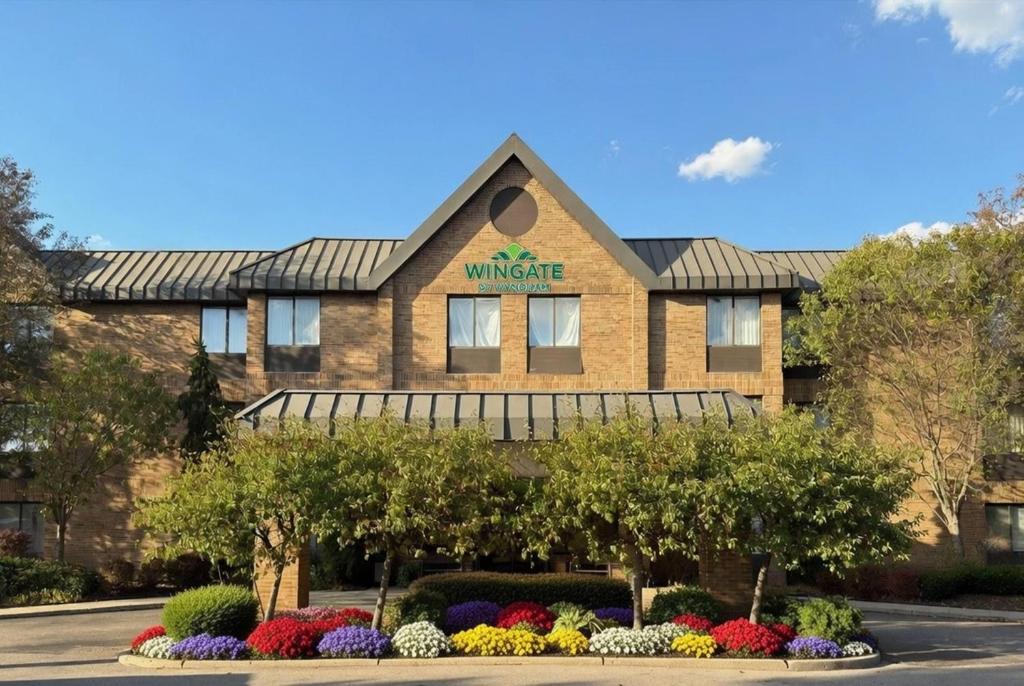 a rendering of the entrance to the wichita windsor hotel at Wingate by Wyndham Utica in Utica