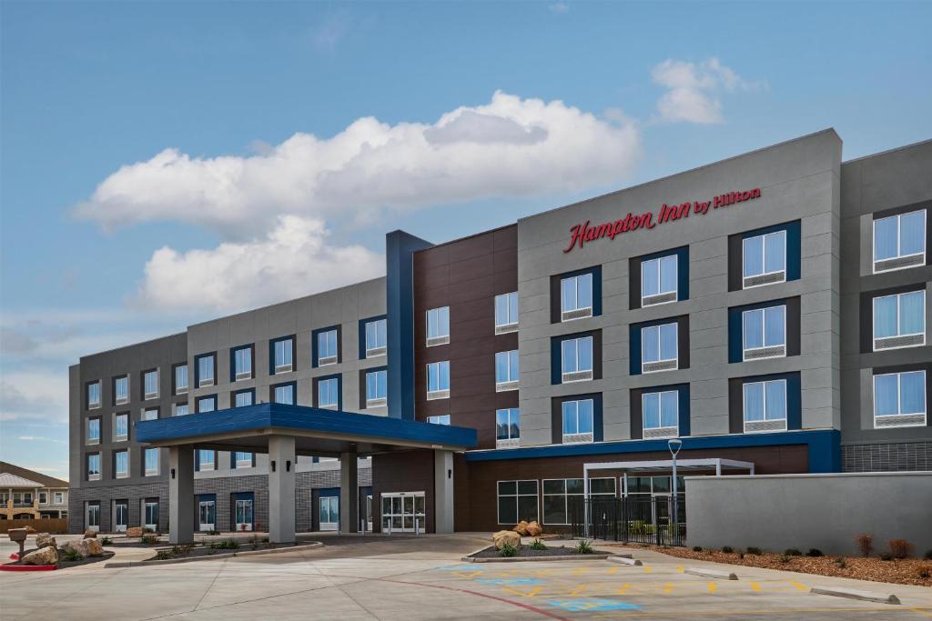 a large building with a hospital at Hampton Inn Midland West in Midland