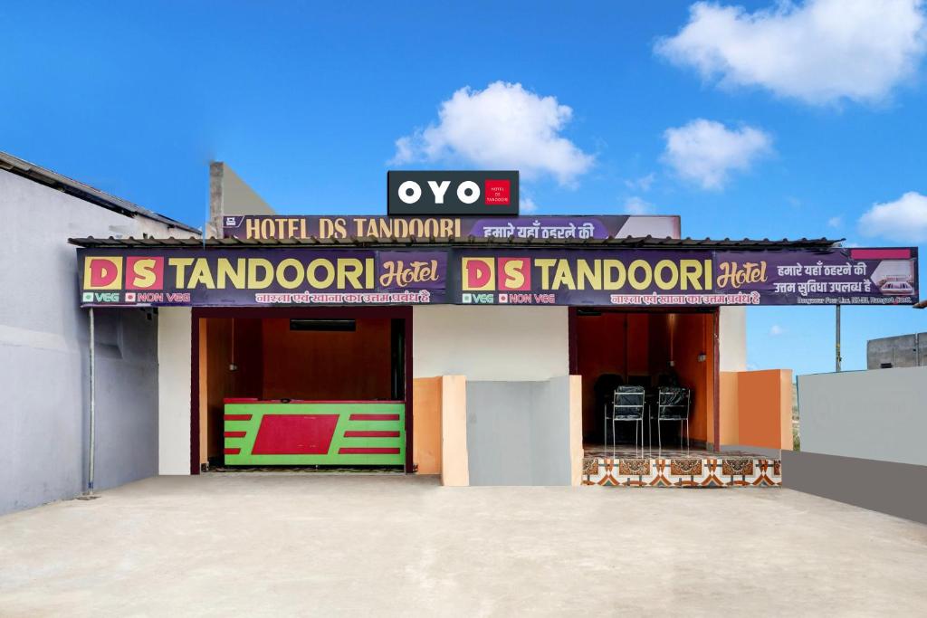 a building with a sign on the front of it at Hotel O DS TANDOORI in Bokāro