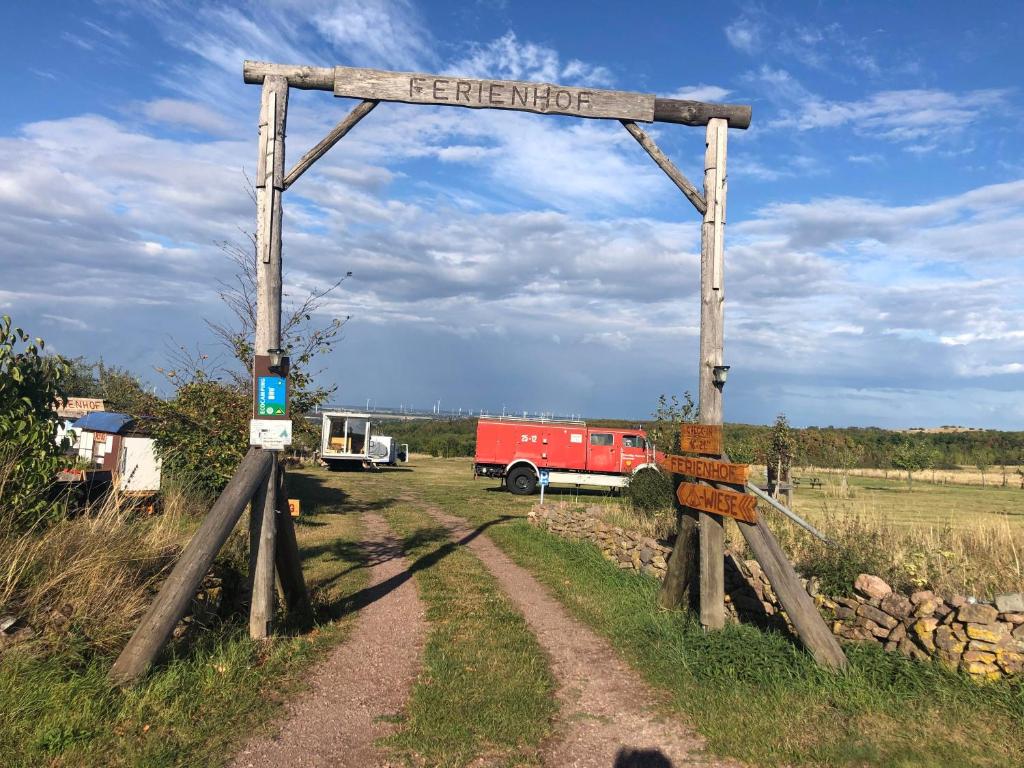 a sign that reads emergency on a dirt road at Ferienhof Löbejün in Löbejün
