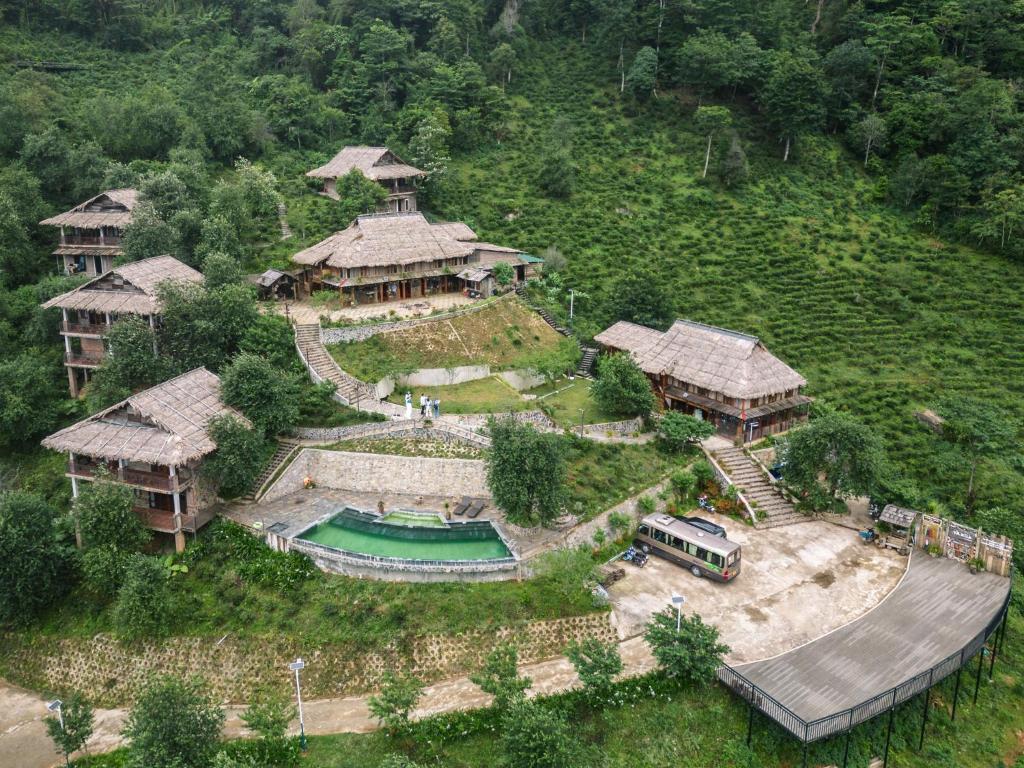 an aerial view of a house with a pool at Ta Xua Ecolodge in Bắc Yên