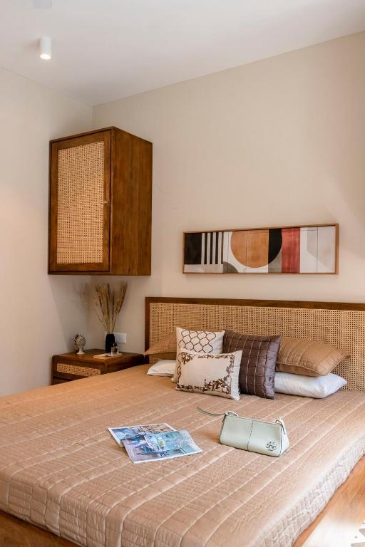 a bedroom with a large bed with at Staymaster Solintra A301 - Pool in Nerul