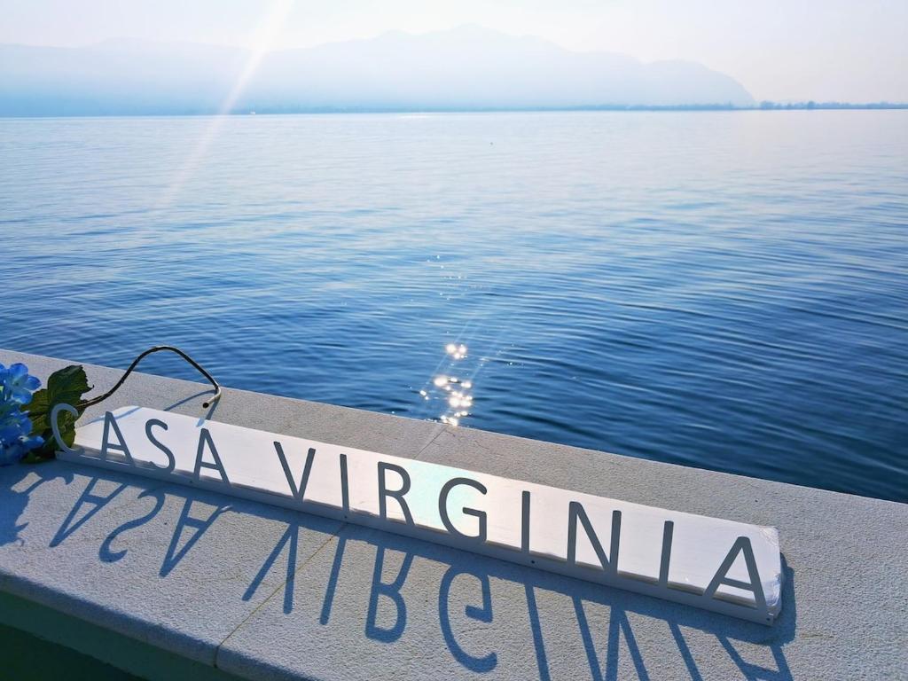 a sign on the side of a boat in the water at CASA Virginia - DEEP BLUE in Predore