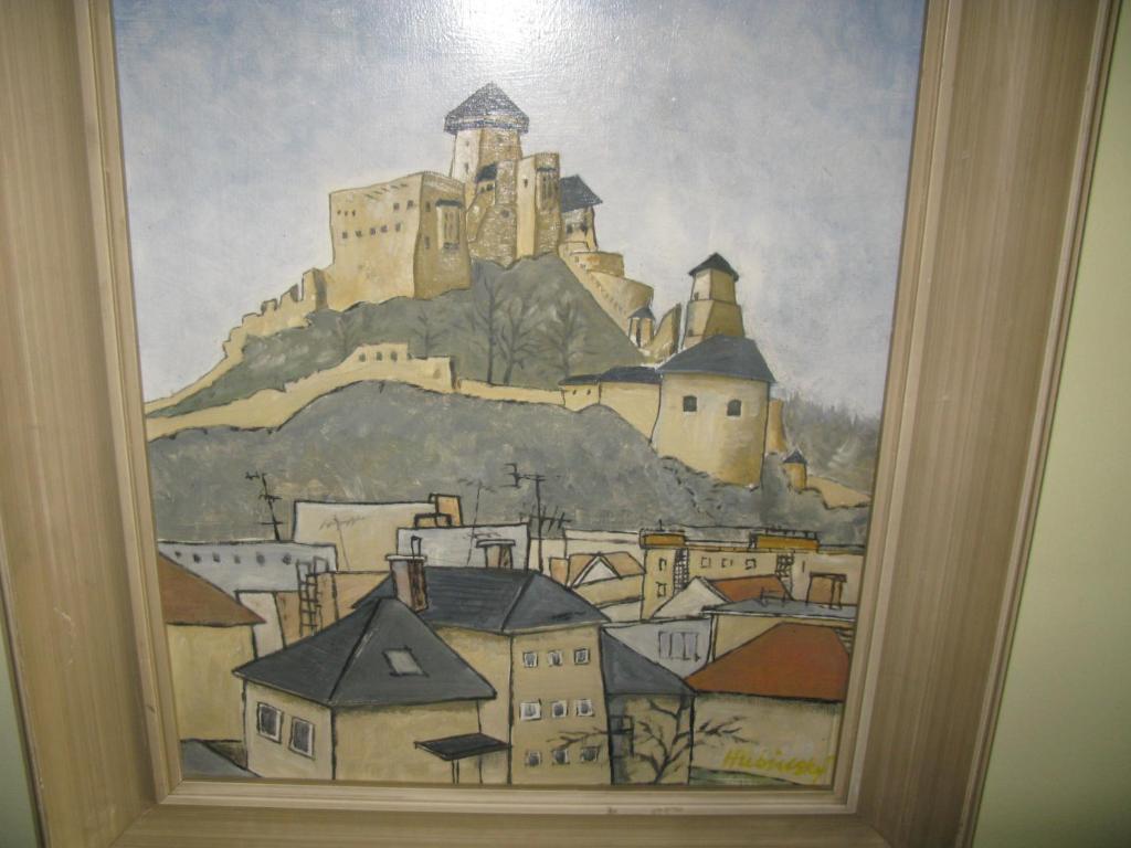 a painting of a city with a castle on a mountain at Apartmán Víťazov in Trenčín