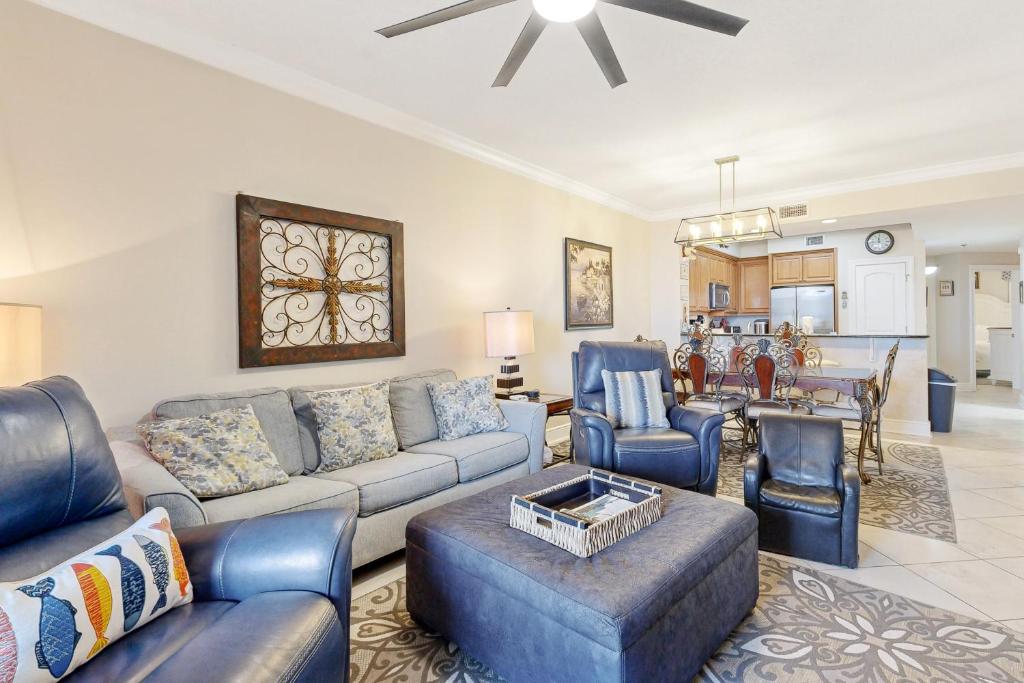 a living room with a couch and chairs at First Floor Condo with a Partial Gulf View Splash Pad and More in Fort Walton Beach