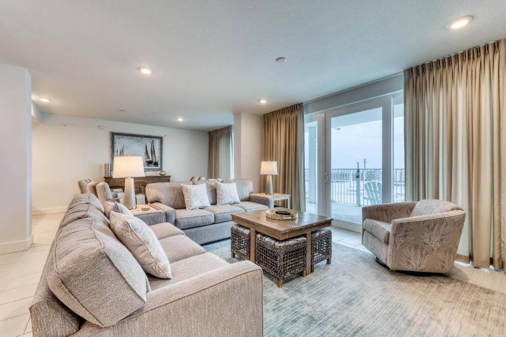 Gulf-front condo with pools and seasonal beach service in a gated community