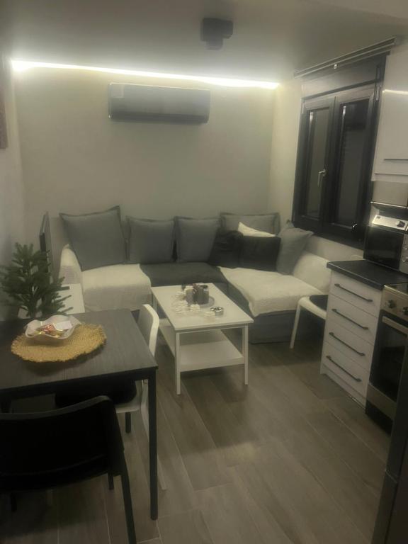 a living room with a couch and a table at Zarko Home in Drama