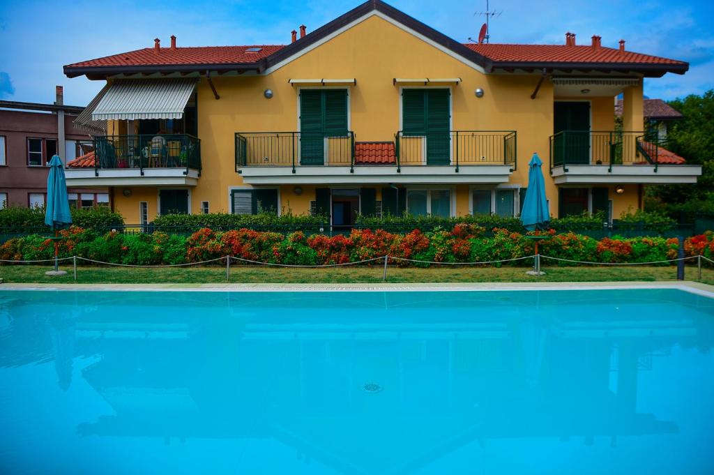 a house with a swimming pool in front of it at Bellagio Breva in Bellagio