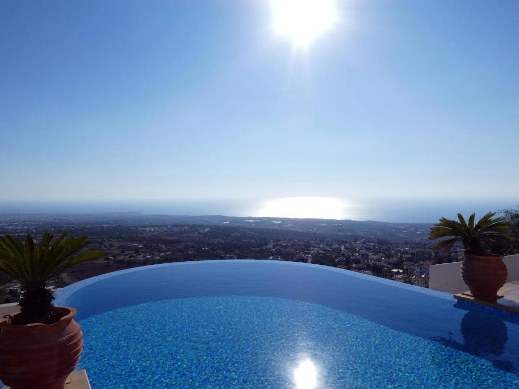 a swimming pool with a view of the city at Breathtaking Panoramic Villa Sea View Infinity Pool in Tala