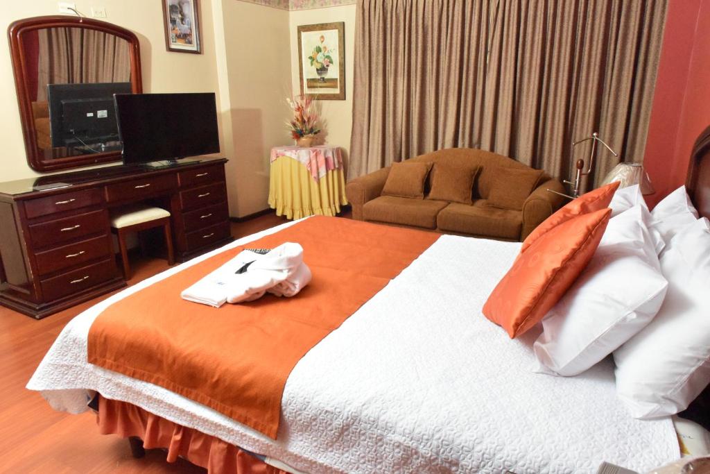 Postel nebo postele na pokoji v ubytování Hotel Makroz