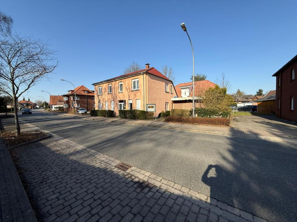 a shadow of a person walking down a street at Soltauer Bleibe in Soltau