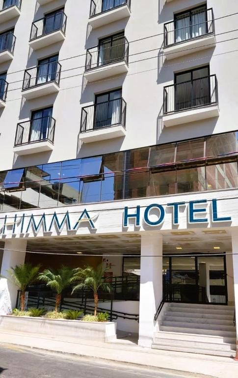 un'insegna di un hotel sulla facciata di un edificio di HIMMA Hotel a Aparecida