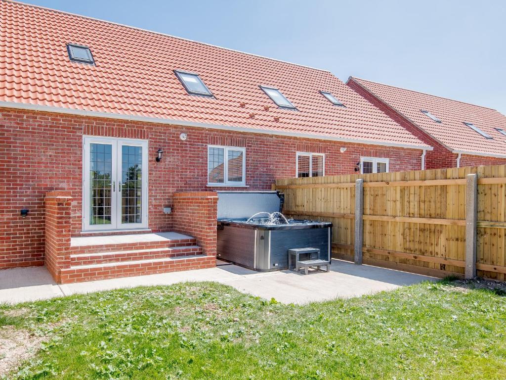 a barbecue grill in the backyard of a house at Dawson Park 8 - Uk12667 in Mablethorpe