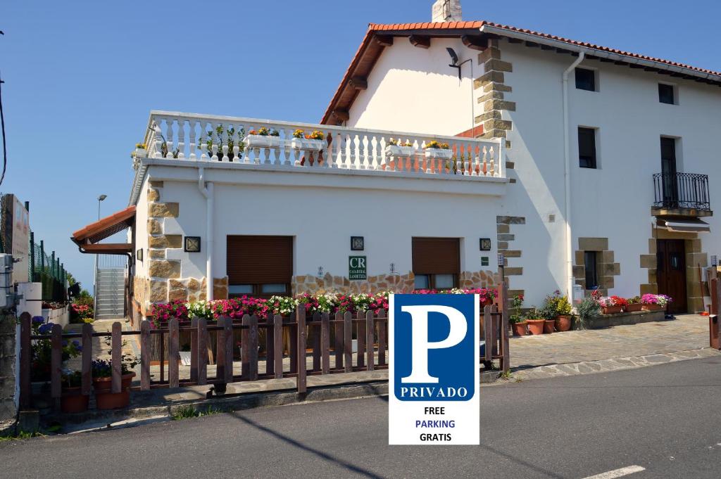a house with a parking sign in front of it at Iturritxo Landetxea in San Sebastián