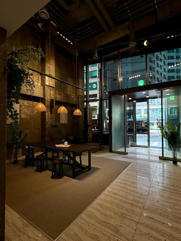 a conference room with a table and chairs in a building at Connected Hotel Guro in Seoul