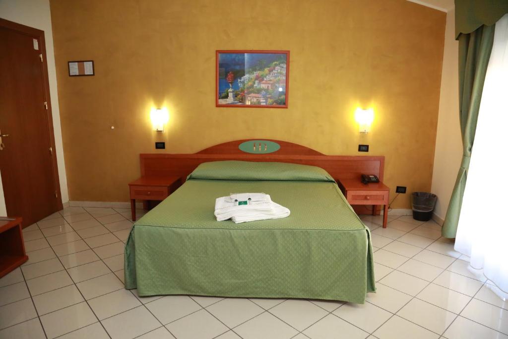 Posteľ alebo postele v izbe v ubytovaní Hotel Dorè