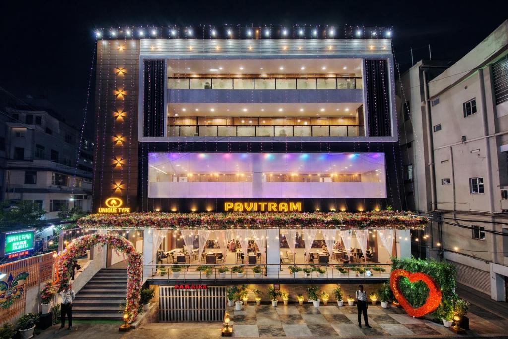 a restaurant in front of a building at night at Pavitram Hotel & Banquet in Rānchī