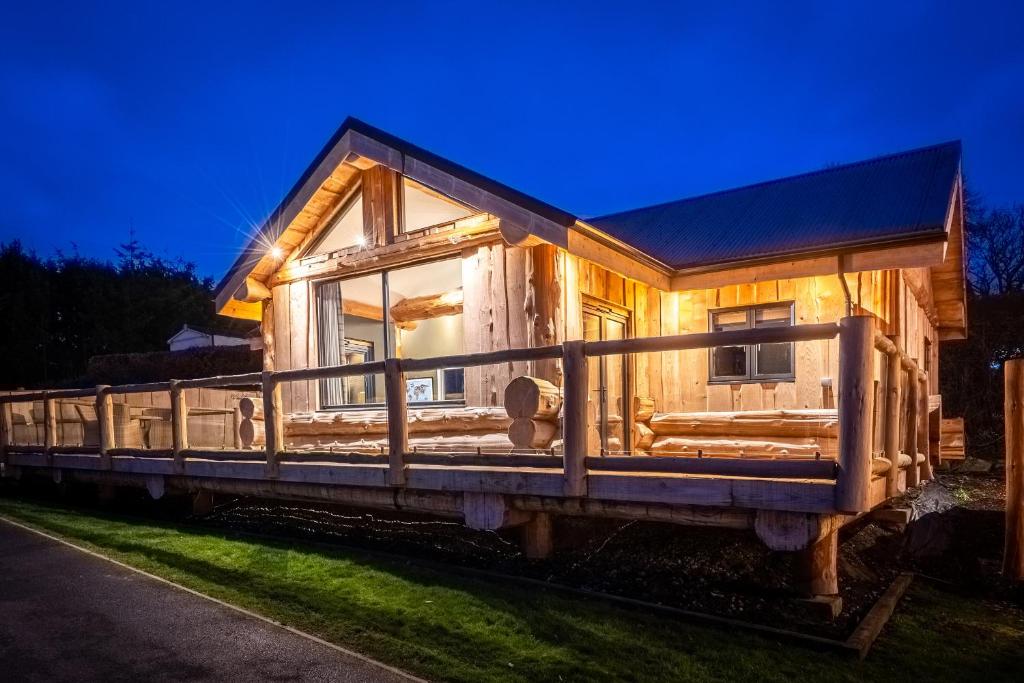 a tiny house sitting on top of a train at Bears Den in Ilkley