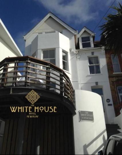 a white house next to a white house at The White House Hotel in Newquay