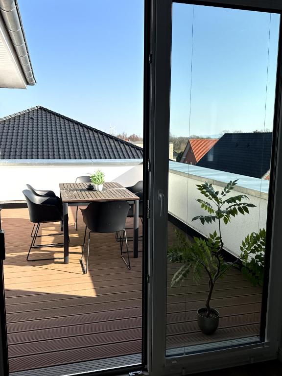 a view of a balcony with a table and chairs at Apartment Sonnenblick in Bohmte