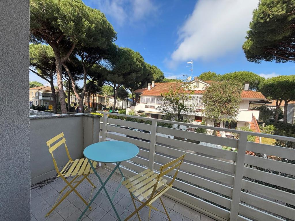 a table and two chairs on a balcony at CV019 - Cervia, bilocale con balcone e posto auto in Milano Marittima