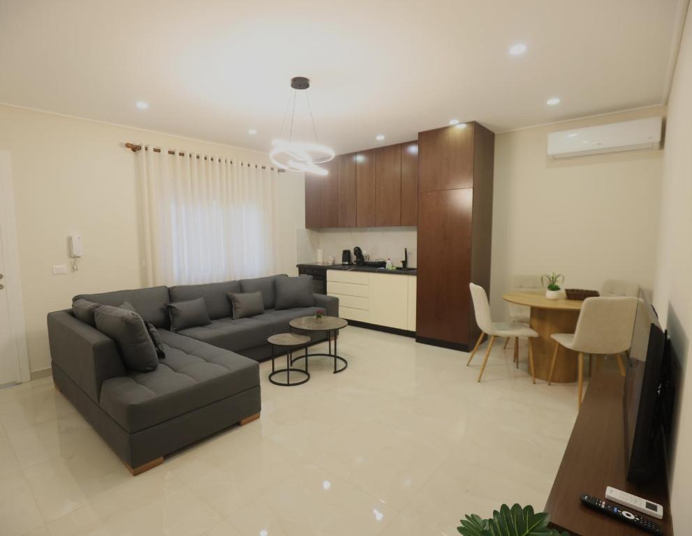 a living room with a couch and a table at The Swan Nest 1 in Pogradec