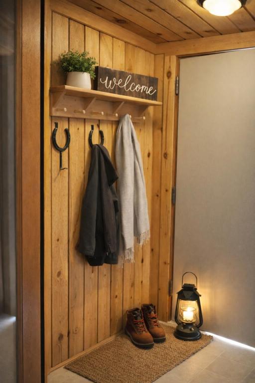a bathroom with a wooden wall with shoes and a light at Lodge Condo 031 in Black Butte Ranch