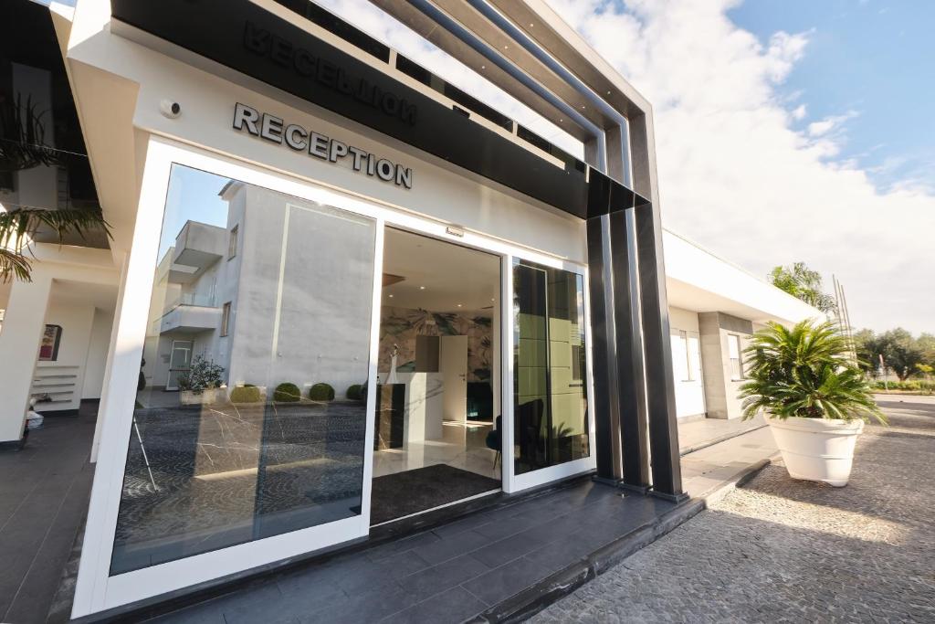 a store front with a large glass door at Le perle del golfo Scafati in Scafati