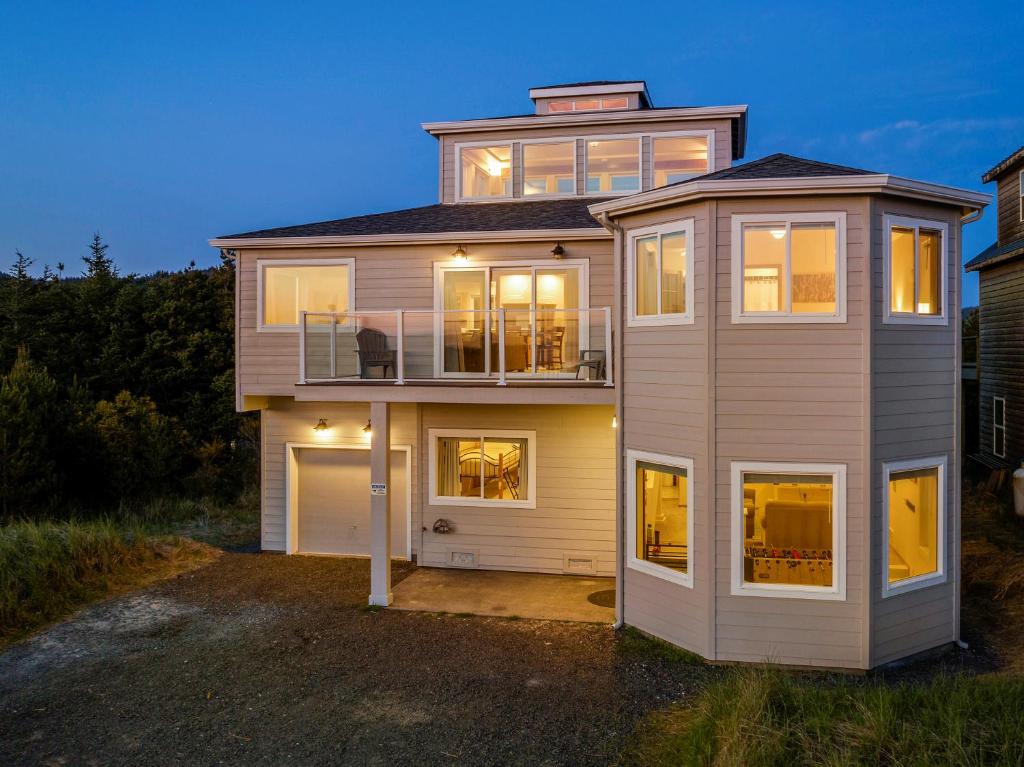 a large house with a lot of windows at Pacific Watch in Pacific City